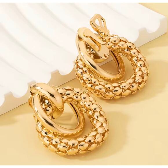 Trendy 1 1/4" clip on large textured loose knot shiny gold earrings - Picture 1 of 4